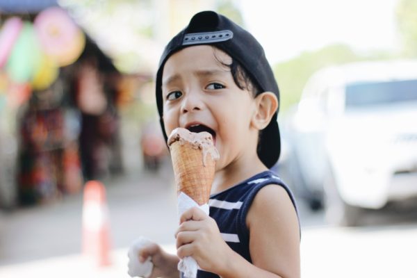boy-eat-ice-cream-with-cone-outside_t20_xvK6eX